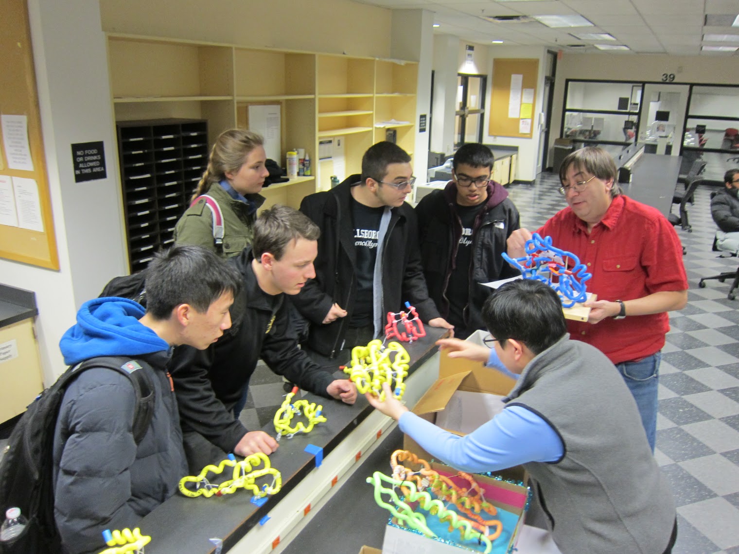 Teams are scored on protein models built in advance, smaller models built during the competition, and a written exam